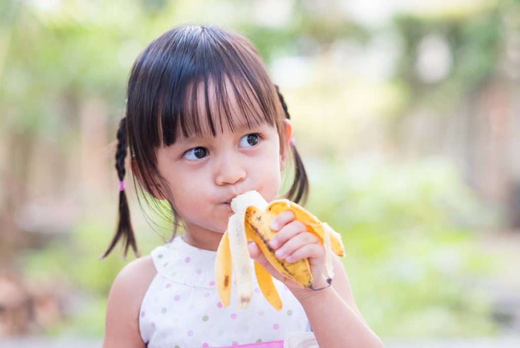 A child eating a banana