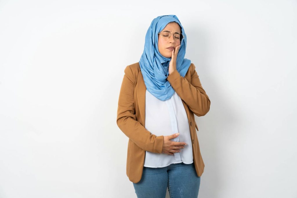 A pregnant woman experiencing discomfort