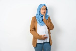 A pregnant woman experiencing discomfort