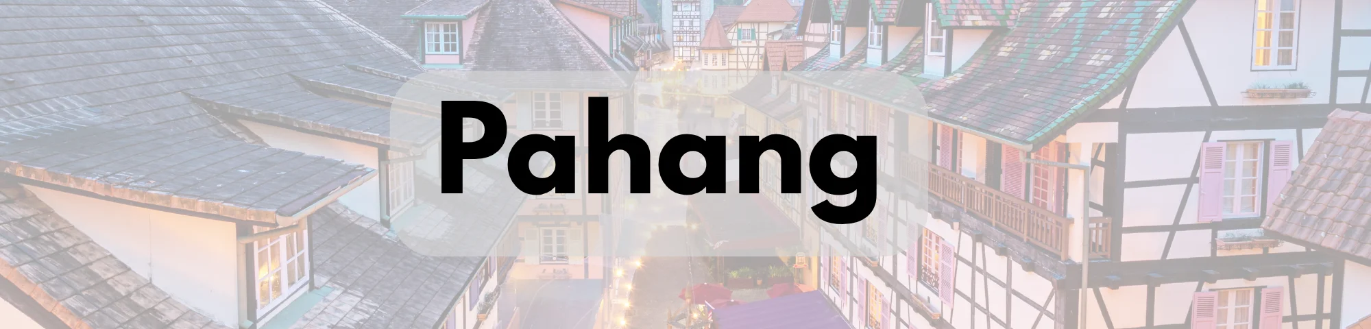 Scenic view of European-style chalet buildings with steep tiled roofs, timber-framed walls, and warm illuminated windows, with the word “Pahang” prominently displayed.